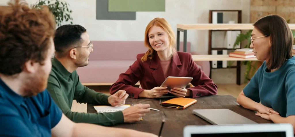 Elite Exceed leadership team discussing digital innovation and business excellence